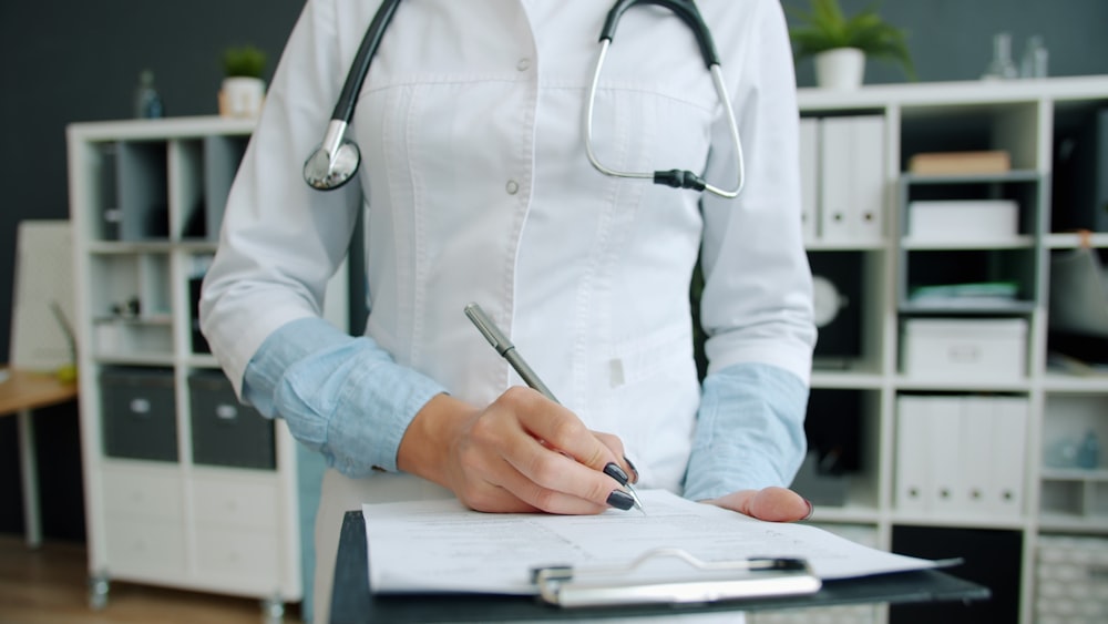 Clinical Trial Reputation Management From Mindshare 3 clinical trial reputation management Doctor writing on clipboard in office
