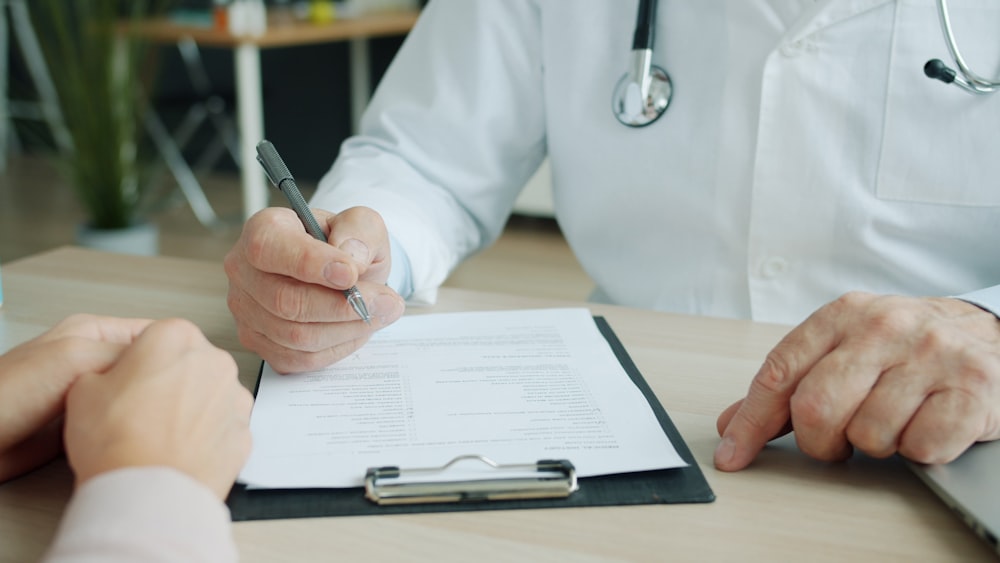 Clinical Trial Local SEO Services From Mindshare 3 clinical trial local seo Doctor writing on a patient's chart
