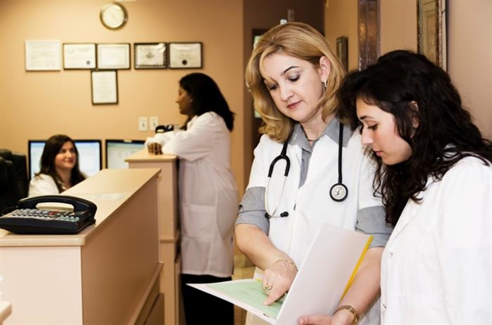 Clinical Trial Patient Recruitment Marketing Agency 6 clinical trial patient recruitment woman in white long sleeve shirt holding white printer paper