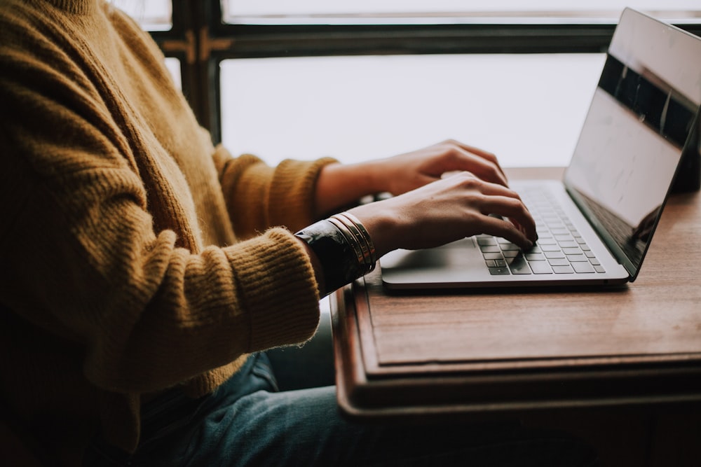 Clinical Trial Email Marketing From Mindshare Consulting 3 clinical trial email marketing person sitting front of laptop