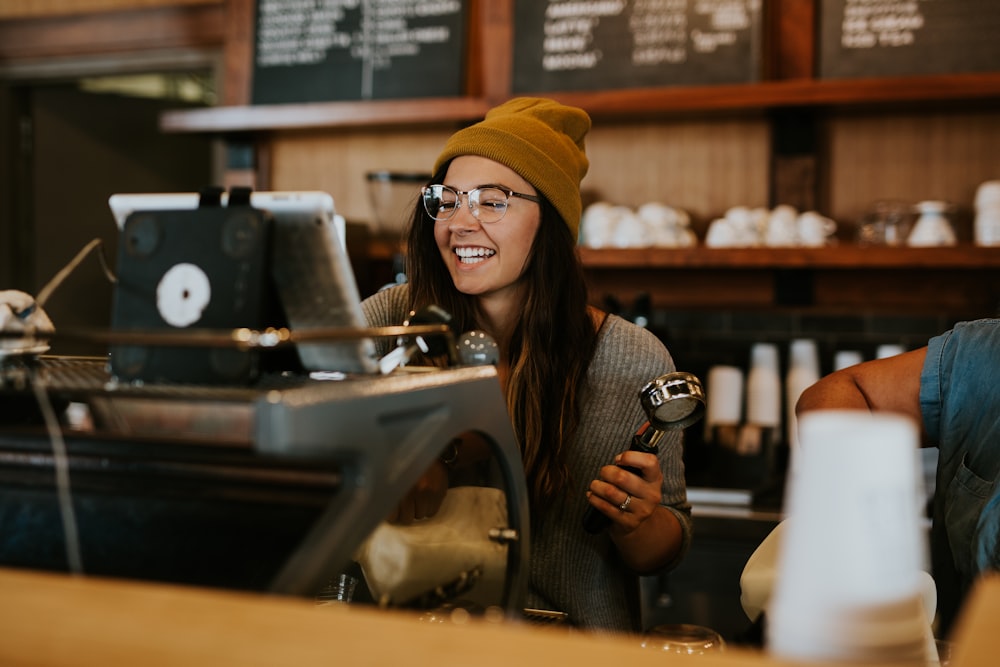 Square Analytics and Reporting for Restaurants 25 woman holding magnifying glass