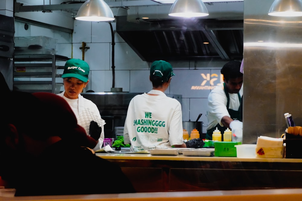 Clover API and Custom Integrations for Restaurants 25 Restaurant staff preparing food in a professional kitchen.
