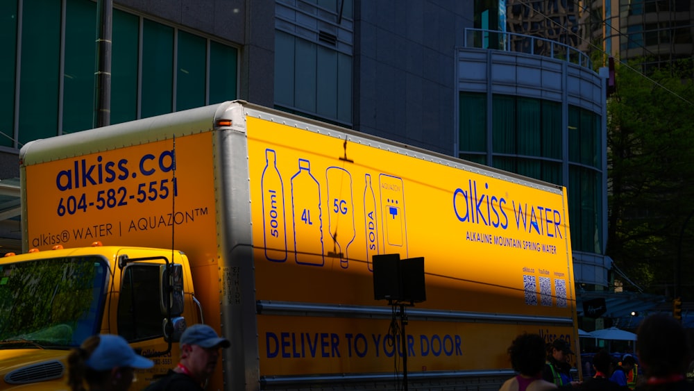 Lightspeed Analytics and Reporting for Restaurants 25 Yellow delivery truck with alkiss water branding.