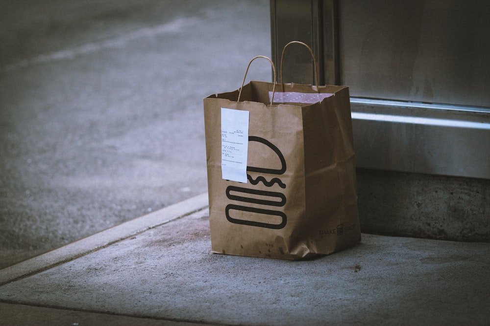 PAR Brink POS Management Services for Restaurants 26 brown paper bag on gray concrete floor