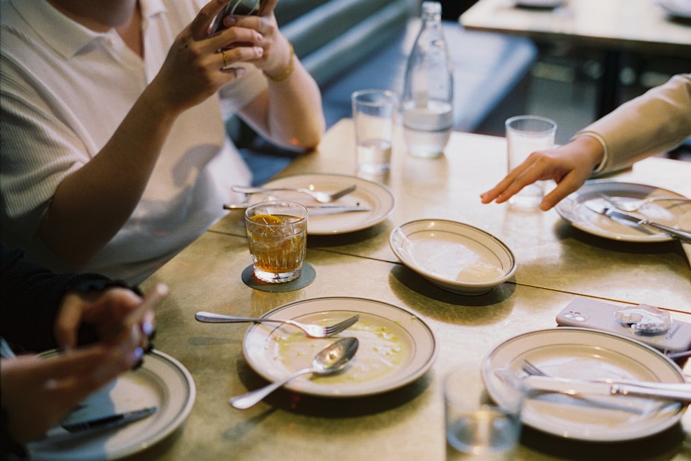SpotOn Online Ordering Setup for Restaurants 26 A group of people sitting around a wooden table