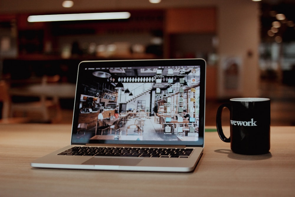 Toast API and Custom Integrations for Restaurants 26 a laptop with a coffee cup
