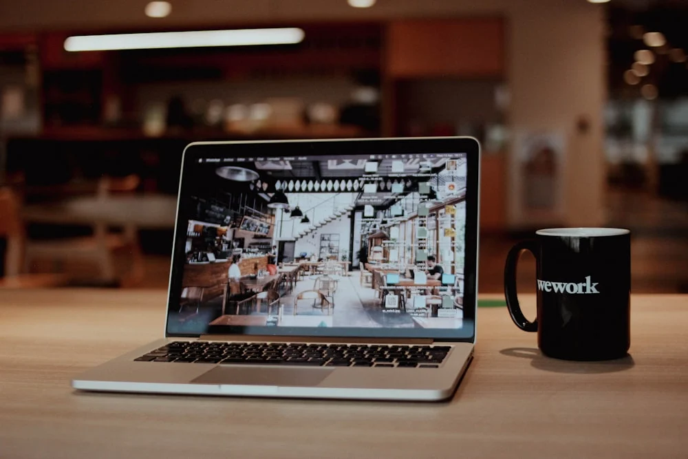 par brink pos website development a laptop with a coffee cup