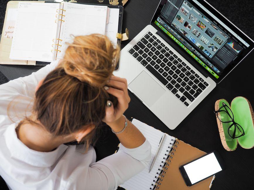 Business owner reviewing website design issues on a laptop