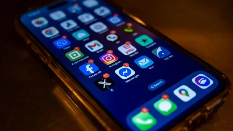 Phone showing app notifications timed around the best times social media austin audiences engage