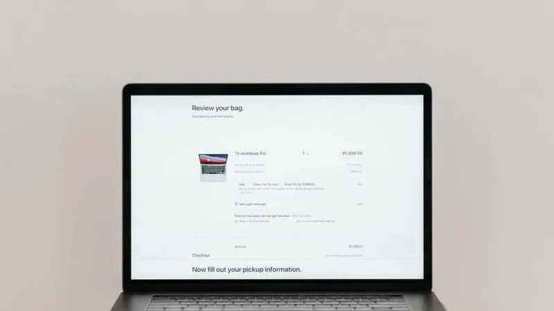 Online shopping cart shown on a laptop, illustrating ecommerce vs lead generation website design