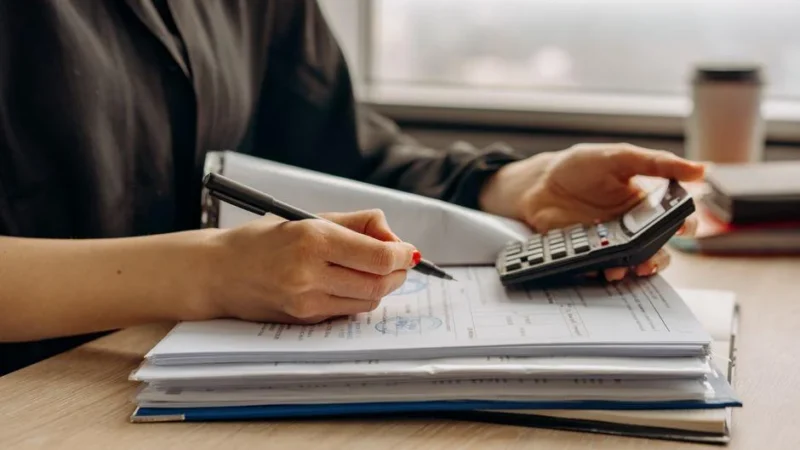 Small business owner reviewing a budget to calculate how much does seo cost in Austin