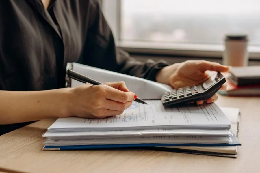 Small business owner reviewing a budget to calculate how much does seo cost in Austin