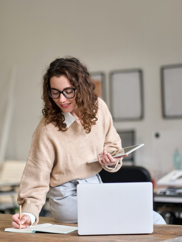 young-smiling-business-woman-working-in-office-using-digital-tablet-vertical.jpgyoung-smiling-business-woman-working-in-office-using-digital-tablet-vertical.jpg